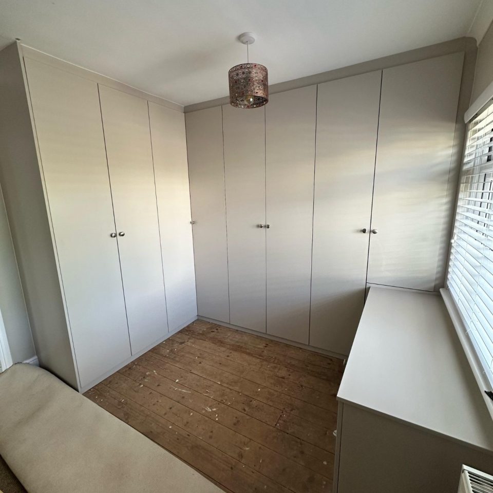 Bespoke fitted hinged corner wardrobe in Kent