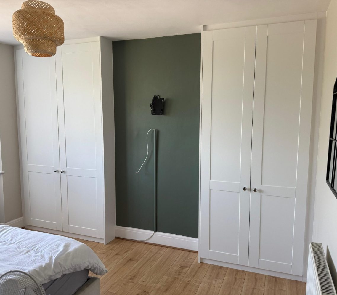 Bespoke fitted, custom made hinged wardrobe fitting around chimney breast. In Chatham, Kent