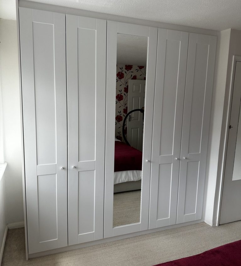 bespoke fitted hinged wardrobe with mirrored door. Custom fitted hinged wardrobe, tailor made to the customers unique requirements in Chatham, Kent.